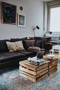 Designer living room interior with a wooden box table and a light blue carpet thumbnail