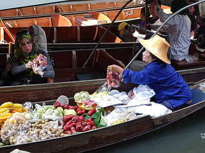 woman with beverage selling on boat thumbnail