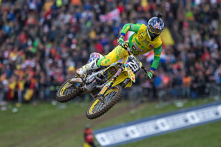 man riding motocross dirt bike in mid air thumbnail