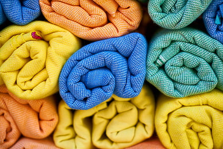 several assorted-color rolled textiles thumbnail
