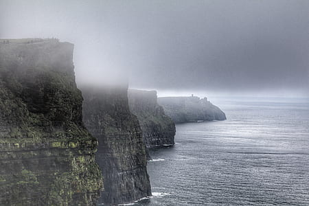 mountain coated with fog at daytime thumbnail