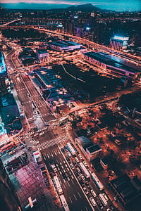 aerial photography of cars on road in the city during nighttime thumbnail