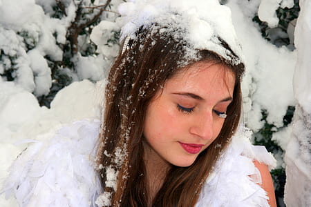 woman lying on covered snow ground thumbnail