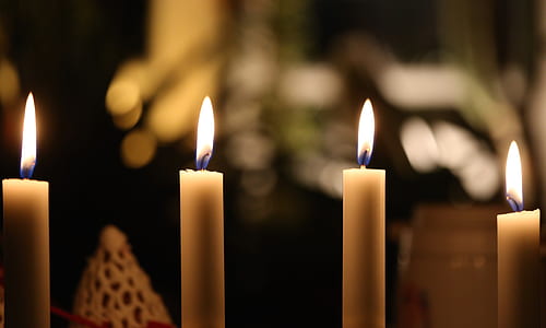 selective focus photography of candles during nighttime thumbnail