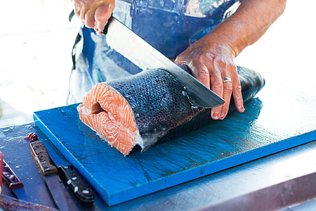 Cutting fresh caught salmon thumbnail