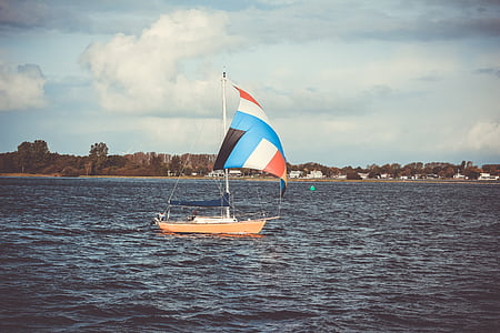 brown sailboat sailing during daytime thumbnail