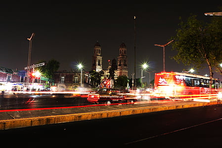 bus on road during night time thumbnail