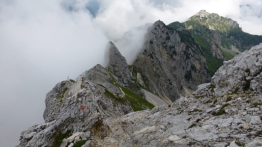 gray rocky mountain covered with clouds thumbnail