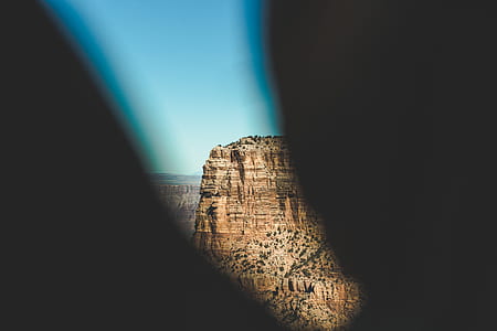 photo of brown cliff during daytime thumbnail