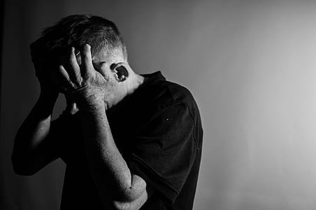 man holding his head thumbnail