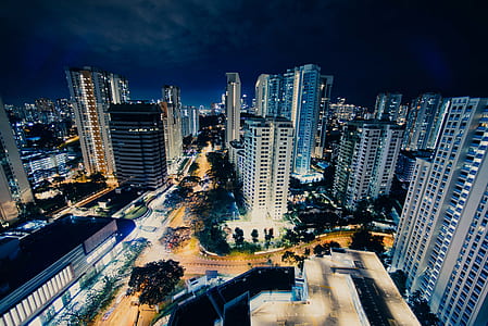 aerial photography of high rise buildings at nighttime thumbnail