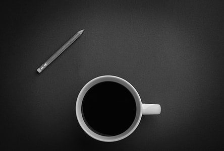 white ceramic mug beside pencil thumbnail