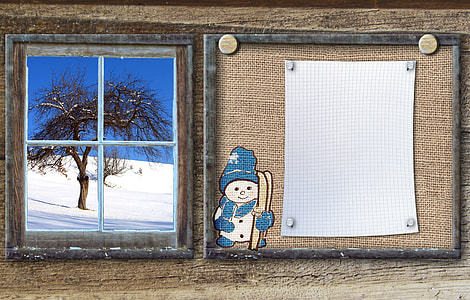 snowman graphic beside glass window thumbnail