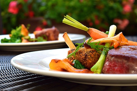 selective photography of cooked meat and vegetables served on white ceramic plate thumbnail