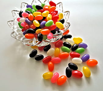 assorted-flavor jelly beans on clear glass bowl thumbnail
