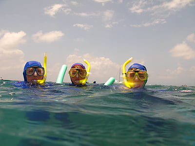 three people wearing scuba gear in water thumbnail