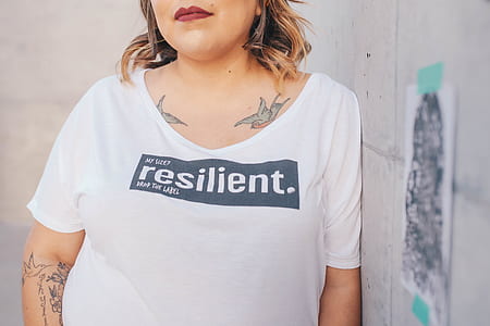 woman in white scoop-neck T-shirt thumbnail