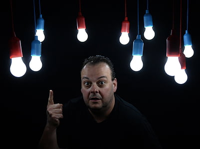 man pointing up with light overhead thumbnail