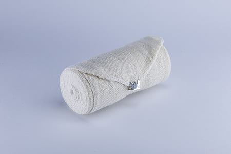 rolled bandage on white surface thumbnail
