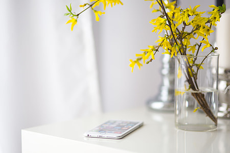 White smartphone with yellow flowers thumbnail