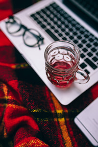 Apple Macbook on a red blanket thumbnail