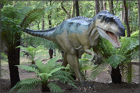 gray and black T-rex statue on forest thumbnail