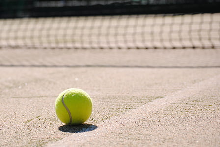 tennis ball on tennis court thumbnail