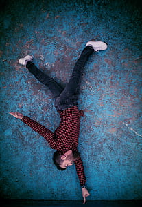 Man Standing on Finger Photo thumbnail