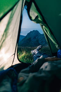 person lying inside tent thumbnail