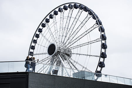 two person standing near ferris wheel thumbnail