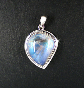 silver-colored pendant with clear gemstone thumbnail