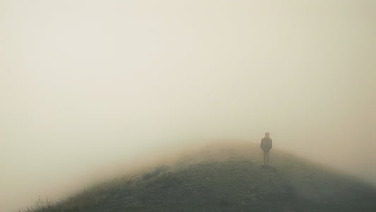 person standing on a foggy mountain thumbnail