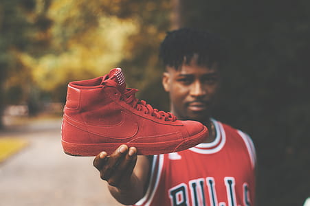 shallow focus photography of red sneaker thumbnail