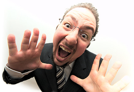 man wearing black suit with mouth open thumbnail