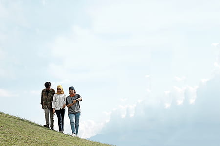 Photo of People Walking on Hillside thumbnail