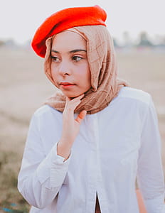 closeup photo of woman holding her chin thumbnail