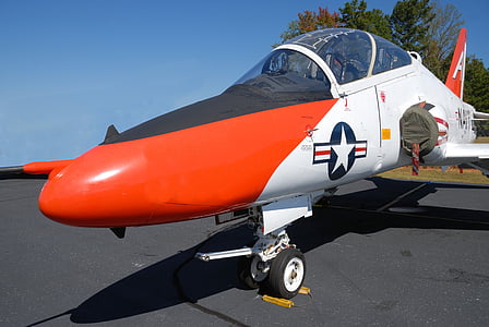white and red fighter jet during daytime thumbnail