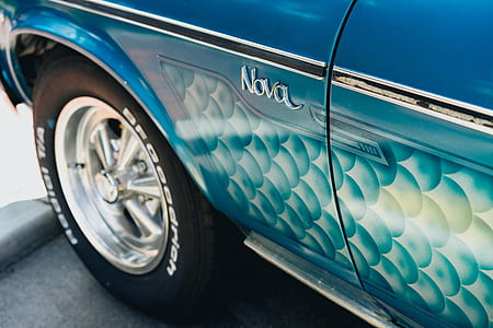 close up photography blue Chevrolet Nova coupe on parked thumbnail