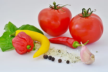 two red tomatoes beside red chili and bell pepper thumbnail
