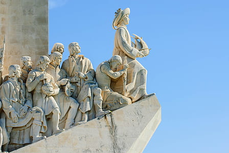 group of people standing on cliff statuettes thumbnail