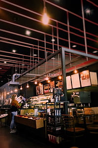 Woman Standing Near Display Counter thumbnail