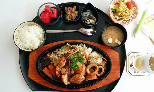 seafood dish, rice, and soup on tray thumbnail