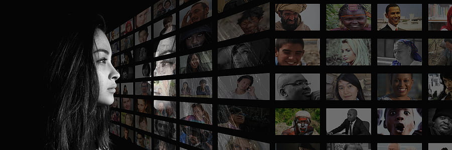 black haired woman looking at assorted photos thumbnail