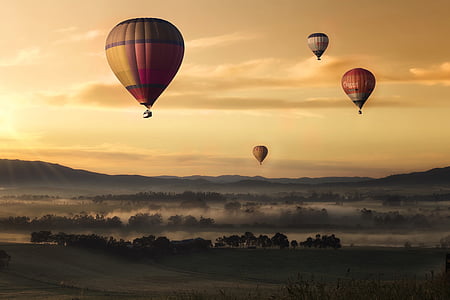 several hot air balloons above ground photo thumbnail