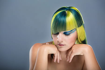 topless woman with green and yellow hair posing thumbnail
