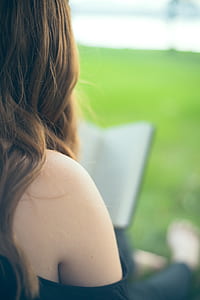 woman wearing black top white reading book thumbnail