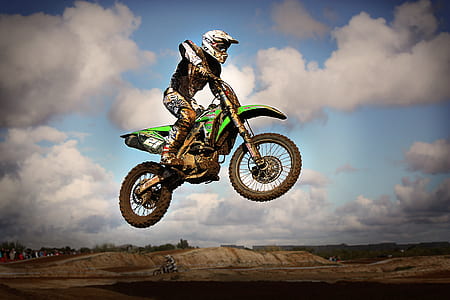 man riding motocross dirt bike thumbnail