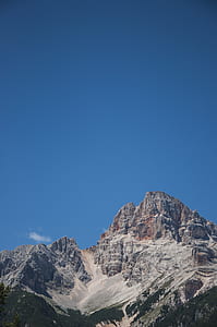 gray rock formation under clear blue sky during daytime thumbnail