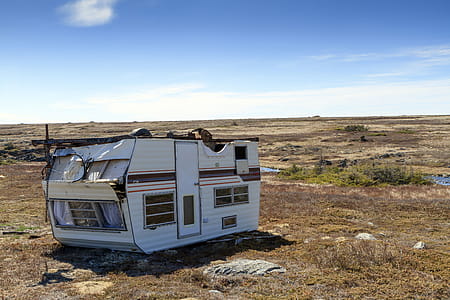 Old caravan trailer over turned and damaged. thumbnail