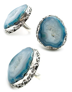 three silver-colored blue rings thumbnail